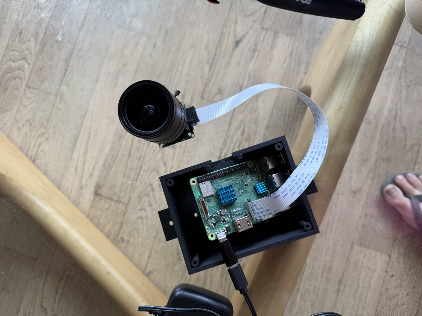 Raspberry Pi 3B+ with bare Arducam HQ camera attached via ribbon cable